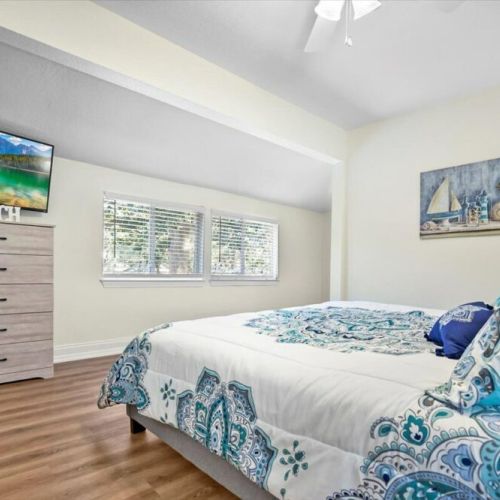 Large Master Bedroom with Smart TV, private full bathroom and walk-in closet.