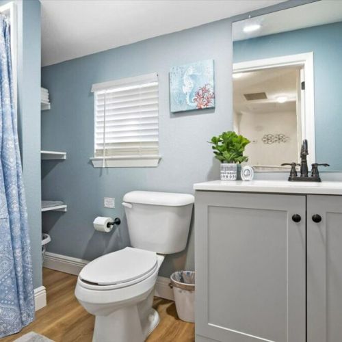 Upstairs guest bedroom with standup shower.