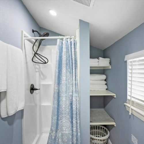 Upstairs guest bedroom with stand up shower