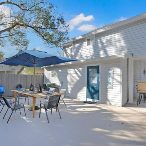 Large outdoor patio area with outside dining table