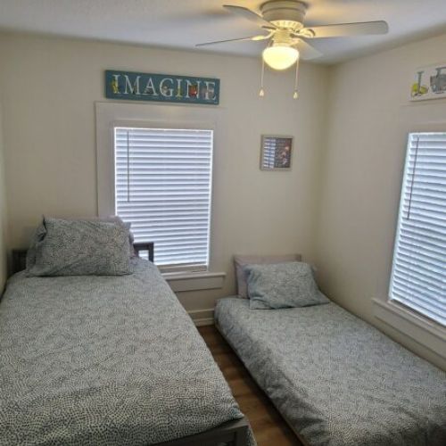 Guest bedroom 3 with a trundle bed that has two single mattresses