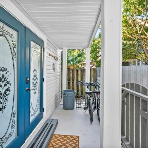 Covered front porch with private fence entrance